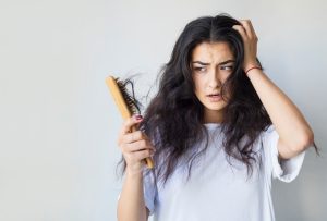 Understanding and Addressing Hair Fall in Women: 4 Causes, Solutions, and Tips 