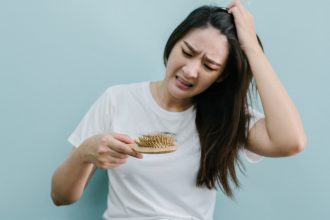 Understanding and Addressing Hair Fall in Women: 4 Causes, Solutions, and Tips