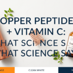 Copper peptide serum and vitamin C dropper with copper wire prop on white stone