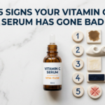 Vitamin C serum with five indicator props showing signs of expiry on white stone surface