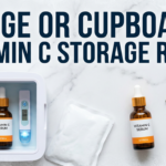 Vitamin C serum beside fridge and thermometer props on cold white marble surface