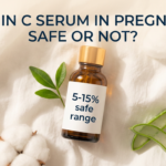 Gentle vitamin C serum with aloe leaf and cotton on soft white fabric in reassuring tones